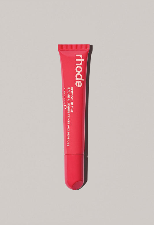 Rhode Skin’s Peptide Lip Tint (guava spritz -  bright coral)